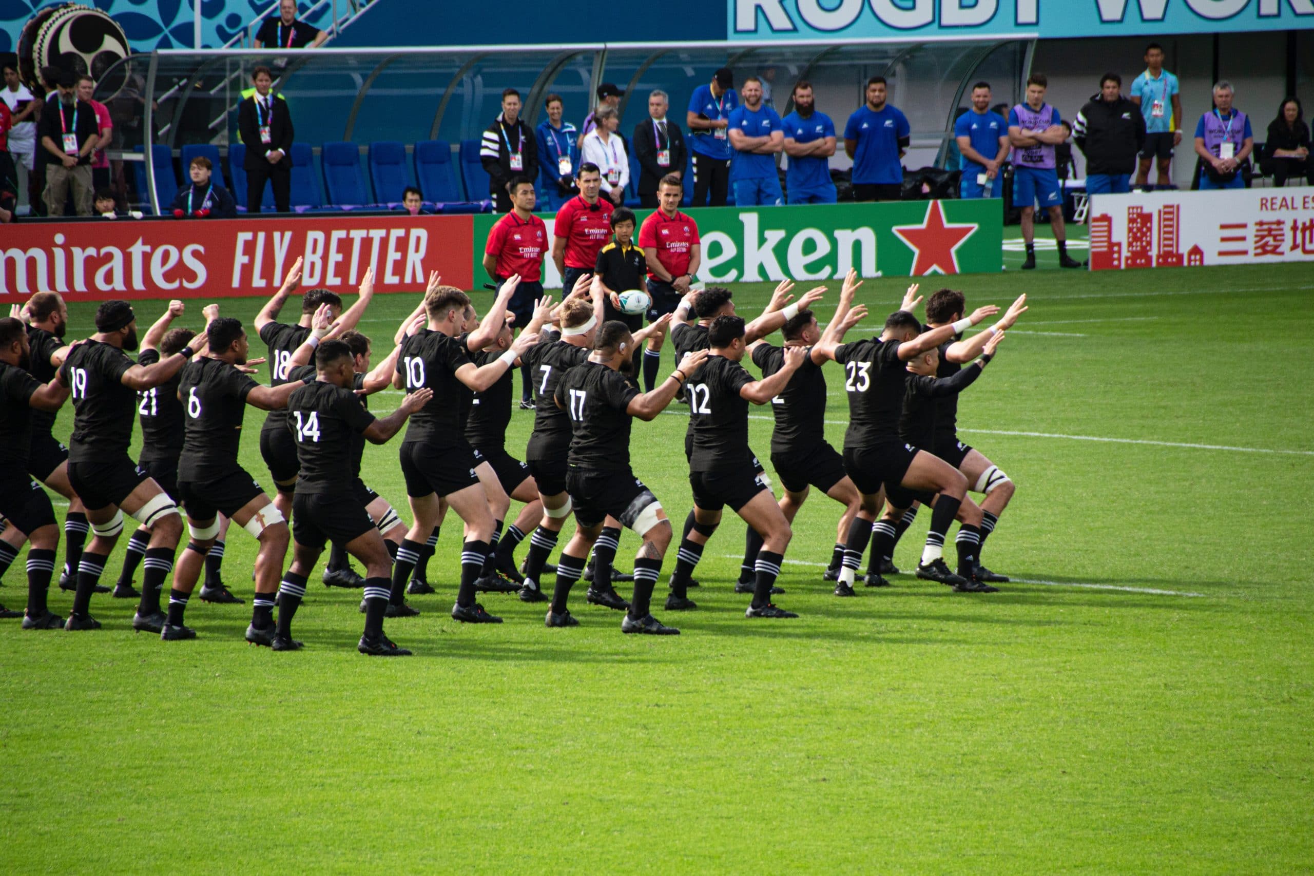 picture of the All Blacks performing the haka on the playing field